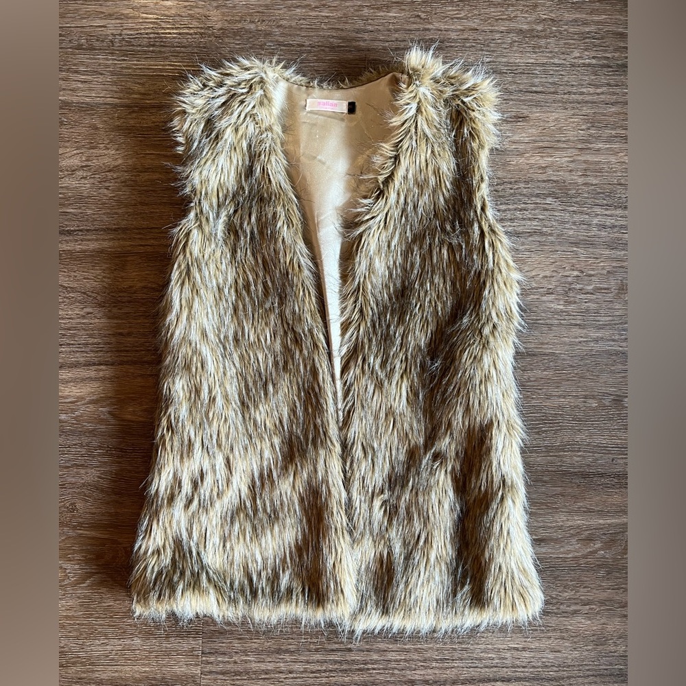 Boutique brand faux fur vest with hidden hook and eye closure.